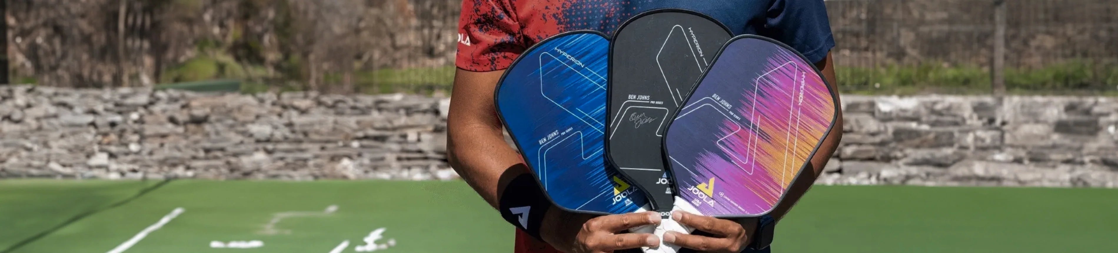 Header image of someone holding three Ben Johns Hyperion Gen 1 Pickleball Paddles.